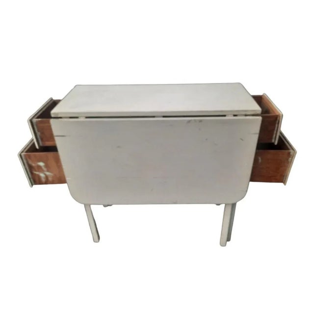 Very Unique Antique 4 drawers Drop Leaf Table,. Lot of storage space with 4 deep drawers on two sides of table. May be use...