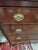 A classic Federal style mahogany American antique chest of drawers having 4 drawer with handsome oval brasses, with reeded...