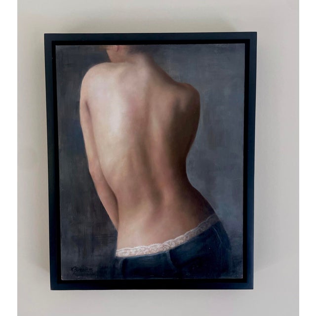 This oil on panel painting captures the delicate form of a woman's back, emphasizing the graceful contours of her spine...