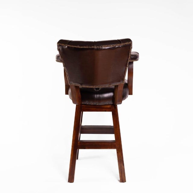 Materials: leather, nail head, wood, solid wood, tufted, brown, black, dark brown, chesterfield Overall width: 27 inches...