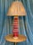 This elegant Spanish deep red glazed ceramic table lamp from the 1950s features stylized draped leaf decorations. Mounted...