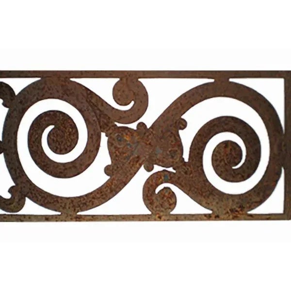 Circa 1900 traditional cast iron grill having scroll motif. Distressed rust finish. Two available, priced individually.
