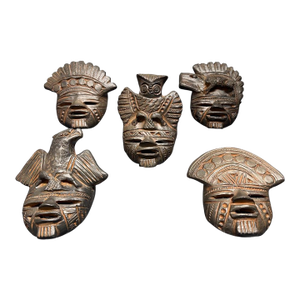 A Set of Five Vintage Colombian Terracotta Decorative Masks.