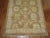 A one of a kind Turkish Oushak Rug with a feminine all over design on a coffee brown ground. Professionally Cleaned and...