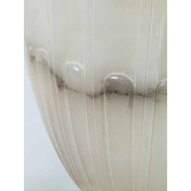 Impressive carved alabaster Neoclassical lamp. Dimensions listed at for the lamp base only (bottom of base to top of...