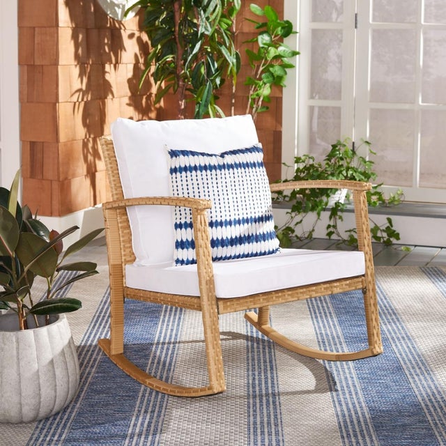 Classic meets contemporary in this sophisticated Daire Rocking Chair. Daires open frame in natural PE rattan emanates a...