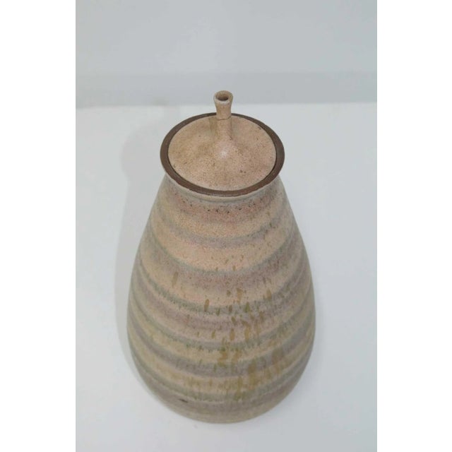 Born in Melrose, Ohio in 1922, Clyde Burt would go on to become a major voice in American studio ceramics. He studied at...