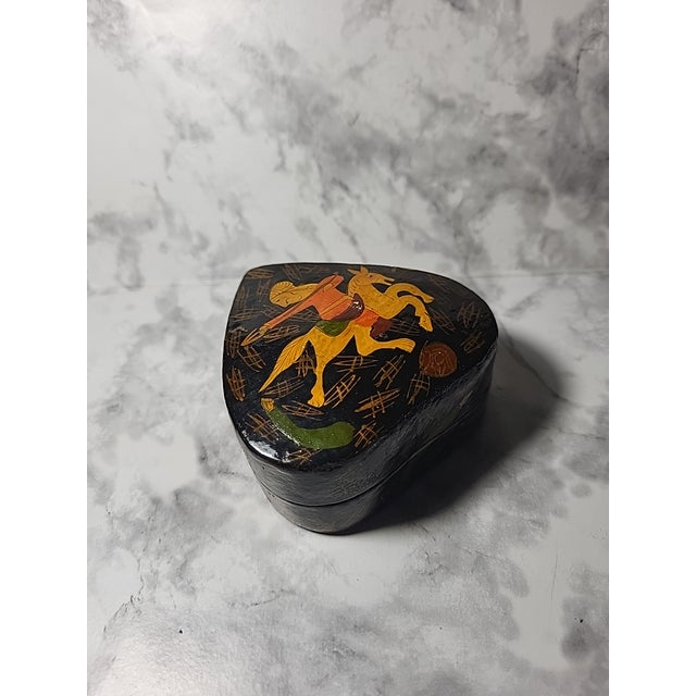 An absolutely exquisite handmade Kashmiri paper mache box. The pattern and colors are breathtaking. A cool piece and an...