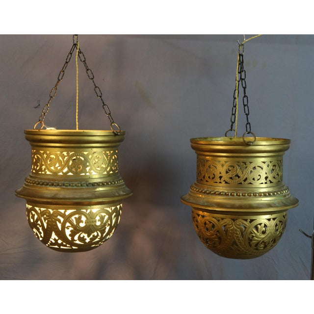 Pair of large openwork bronze lanterns, 19th century. DIMENSIONS: 48cm in diameter and 43cm in height. 80cm including...
