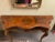 Mid 20th century reproduction of a French Louis Style console table. Brass beaded trim and ormolu decorate the top and...