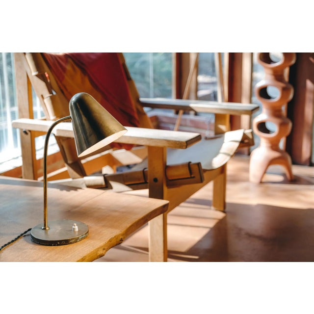 1950s brass table lamp attributed to Jacques Biny. An exceptionally clean and simple design executed in patinated brass...
