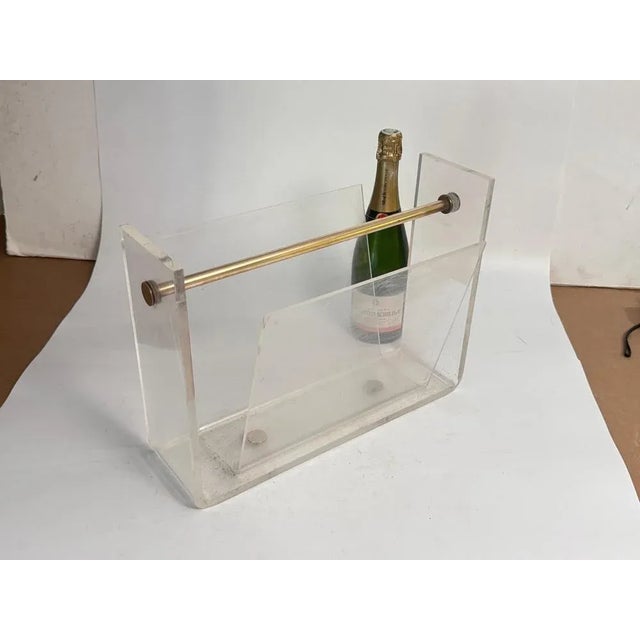 A French midcentury magazine holder from the 1970s, with Chromed Steel divider, for two compartments to store books or...