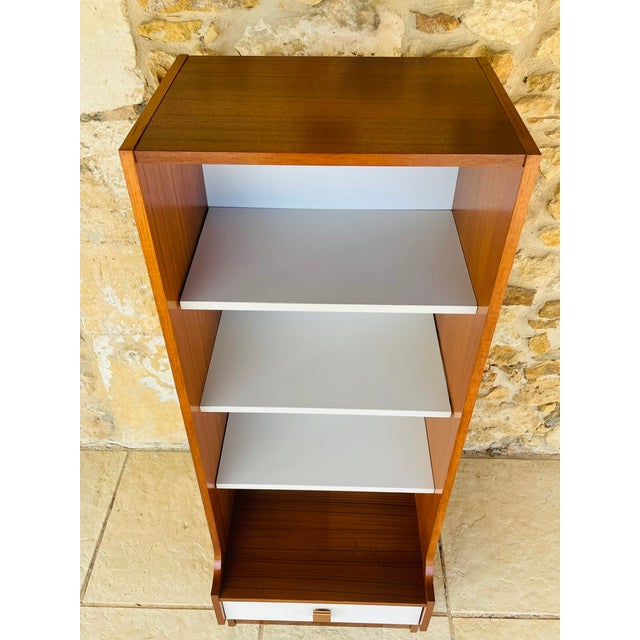Vintage, scandinavian-style shelving unit circa 1970's this piece features a warm teak veneer structure with an open...
