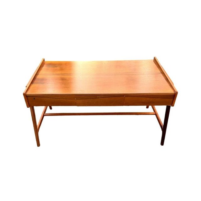 This elegant writing desk, designed by the renowned Danish designer Arne Wahl Iversen, exemplifies the essence of mid-...