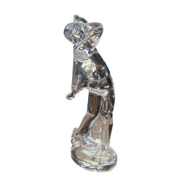 Elegant pair of Baccarat clear crystal golfer figurines, each beautifully sculpted in a different golfing pose. The...