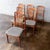 A set of six classic mid-century teak dining chairs by Benny Linden, recently reupholstered in a durable gray tweed for a...