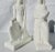 Pair of kneeling figures holding allegorical materials. Fine white blanc de chine porcelain by De Vegh working for...