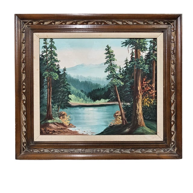 This vintage oil painting on canvas depicts a serene mountain lake landscape, set amidst the beauty of nature. The artwork...