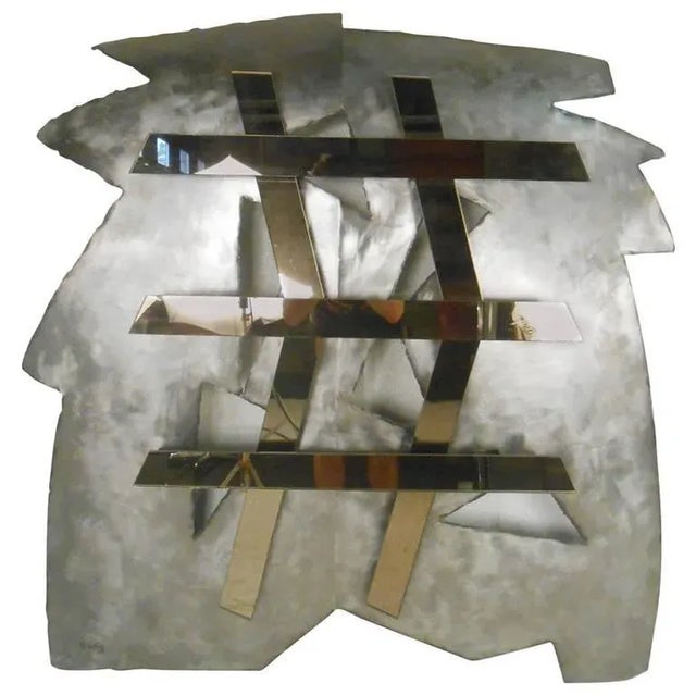 This modernist wall sculpture by D. Selig features mirrored glass mounted on steel. Dimensions: H 40 in. x W 39 in. x D 5...