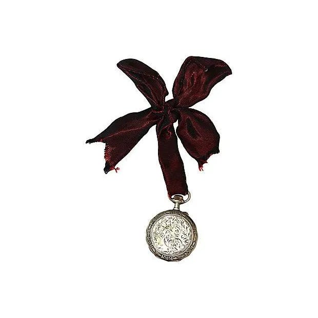 Antique Swiss sterling silver pocket watch ornament with grosgrain ribbon hanger. Maker's mark on back. Light wear,...
