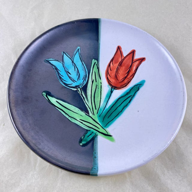 From the Atelier Cérenne à Vallauris in France, a hand made pottery Tulip plate, circa 1940-1950. The plate is finished in...