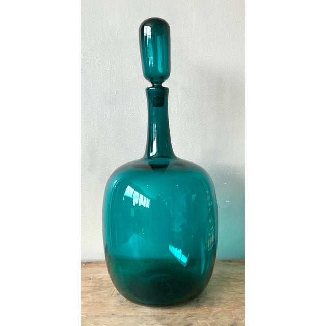 Adorn your collection with this stunning vintage Boho blown glass decanter, a vibrant testament to the artistry of mid-...