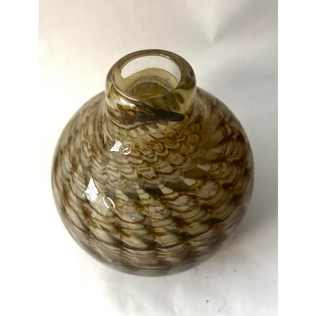 A beautifully worked handblown studio glass vase by American glass artist Doug Sweet, signed and dated “Sweet 77” on the...