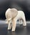 A beautifully sculpted matte white elephant featuring soft, rounded lines and a refined minimalist silhouette. With its...