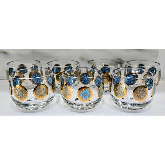Bring mid-century cocktail-hour glamour to your bar cart with this set of seven vintage roly-poly cocktail glasses,...