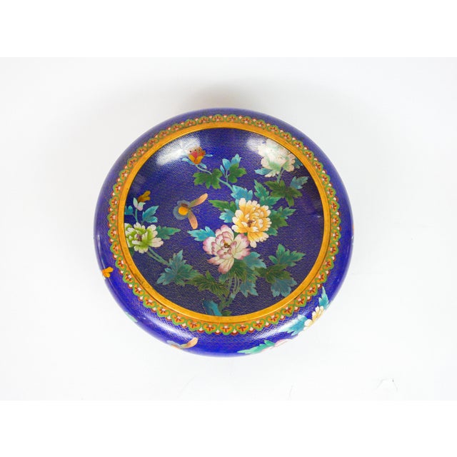 Beautiful Cloisonne Bowl with Stand. Vibrant blue dominant color with pink and yellow flora and butterflies. Brass-...