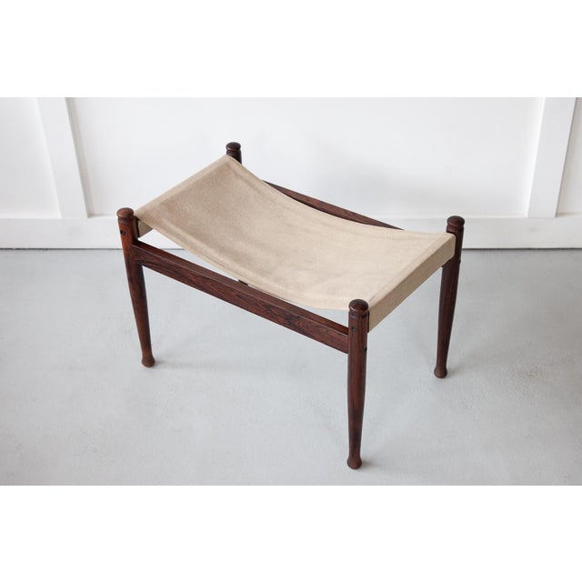 The 'Safari' ottoman, designed by Erik Wort for Niels Eilersen during the 1960's, in Denmark. Featuring a solid rosewood...