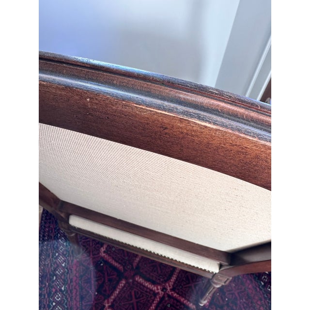 This William Switzer chair has a hand carved frame. The seat cushion is down filled. The upholstery is in beautiful...