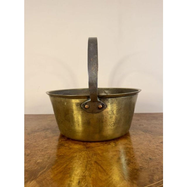 Quality heavy antique Victorian brass jam pale, having an iron shaped handle to the top of the quality brass jam pale.