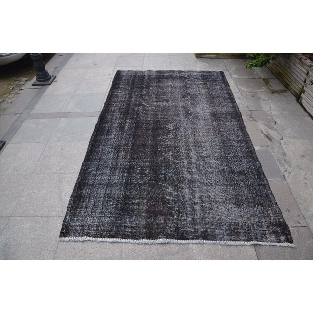 A Turkish handmade vintage Anatolian Oushak rug. We collect old vintage antique rugs from Anatolia, which is the eastern...