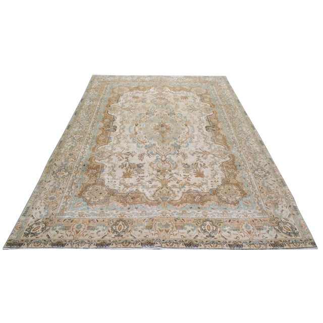 Hand-knotted with care using traditional rug-making techniques, this wool rug blends timeless craftsmanship with a modern...