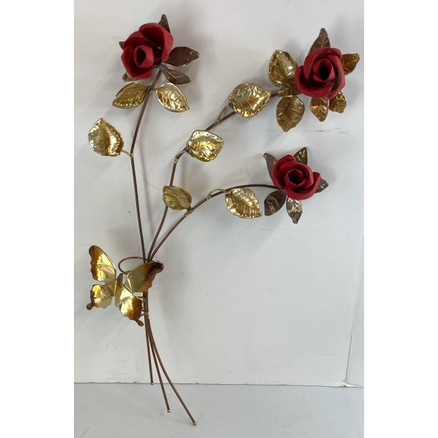 Vintage brutalist metal wall art in the shape of three long stem roses.