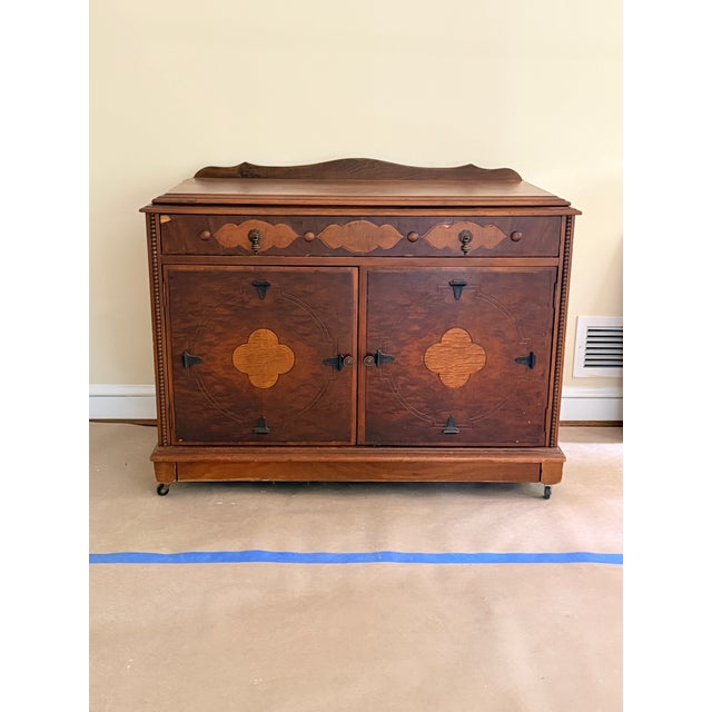 Antique Eastlake Wooden Cabinet Likely from late 19th century, this wooden cabinet is adorned with decorative inlays of a...