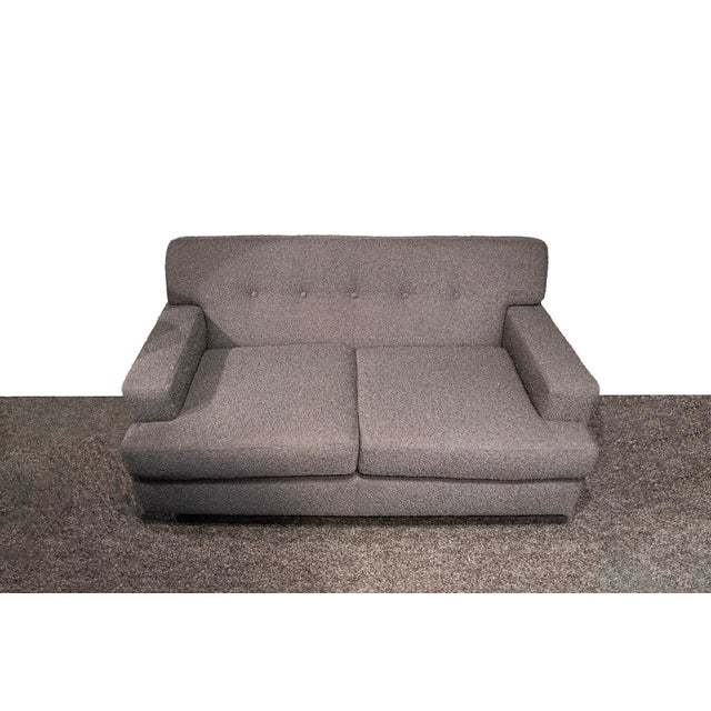 Two-seater sofa with fabric-covered padding and wooden feet. Reupholstered. Square model Designer Marco Zanuso...