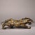 This striking antique bronze sculpture depicts a mythical beast, possibly a reclining unicorn or guardian creature,...