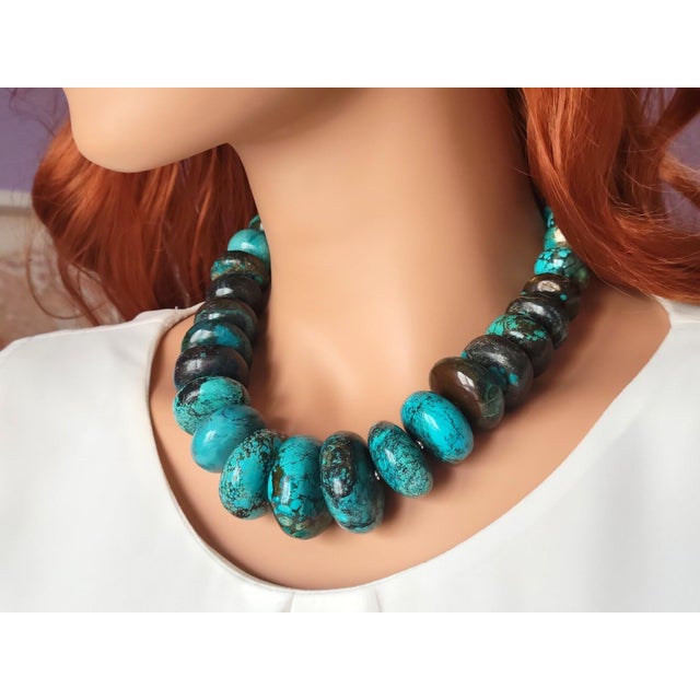 The length of the necklace is 19 inches (48 cm). The size of the rondelle beads varies from 16 mm to 33.5 mm. Turquoise...