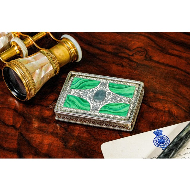 This exceptional early 19th century continental silver snuff box showcases the refined artistry and meticulous...