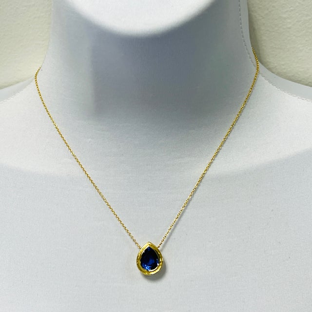 Beautiful 6.65 ct. tanzanite pear shape. Handmade in 18k yellow gold. Length is 16".