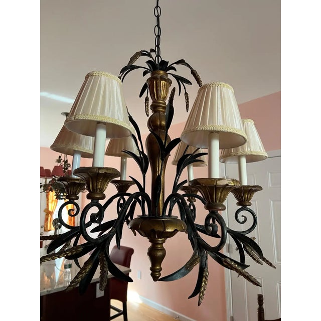 Vintage Regency Tole Wheat Sheaf Chandelier in the style of Currey and Company. Painted black tole and wooden gilt design...