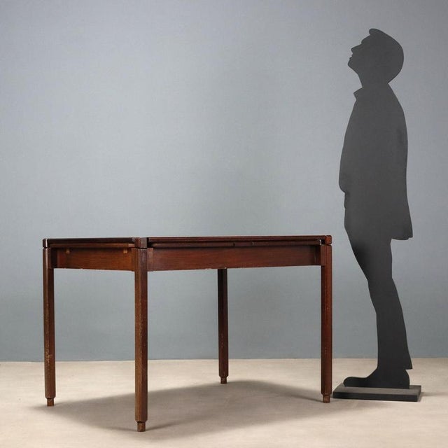 Vintage table with exotic wood veneer, extendable with extensions and a top that can be flipped up and used as a game...