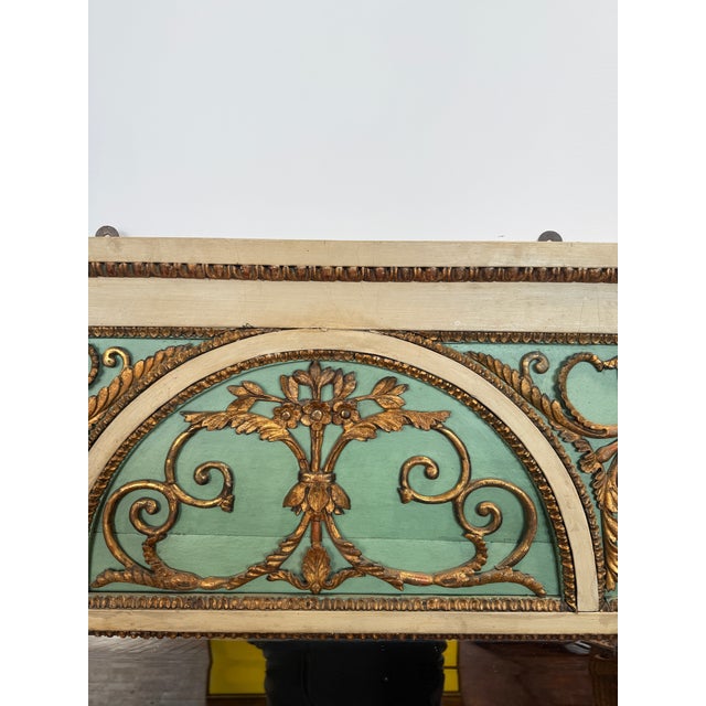 This French 19th-century painted and giltwood overmantel mirror is conceived in a refined Neoclassical, Louis XVI Revival...