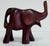 Vintage beautifully carved wood elephant figurine with a raised trunk for good luck. Age wear. No breaks.