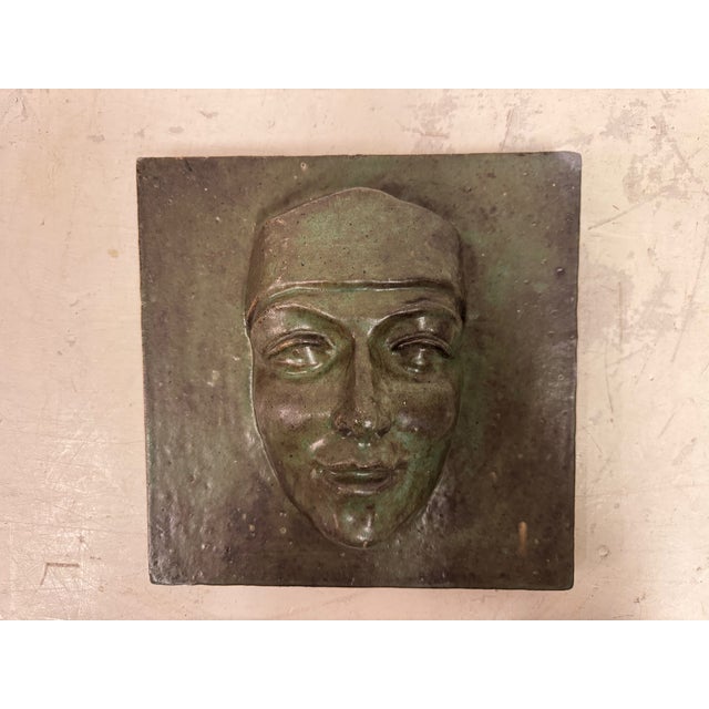 Studio Pottery Face Plaque, Mid-20th Century A compelling ceramic face plaque, likely mid-20th century, rendered in low...