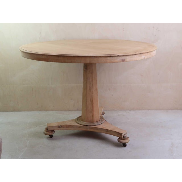 Fabulous small round table. Made from bleached tropical hardwood and pine Original castors