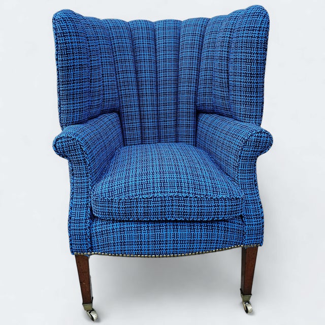 This is an Antique Federal Barrel Back and newly reupholstered wingback. The chair's barrel back shape is typical of the...