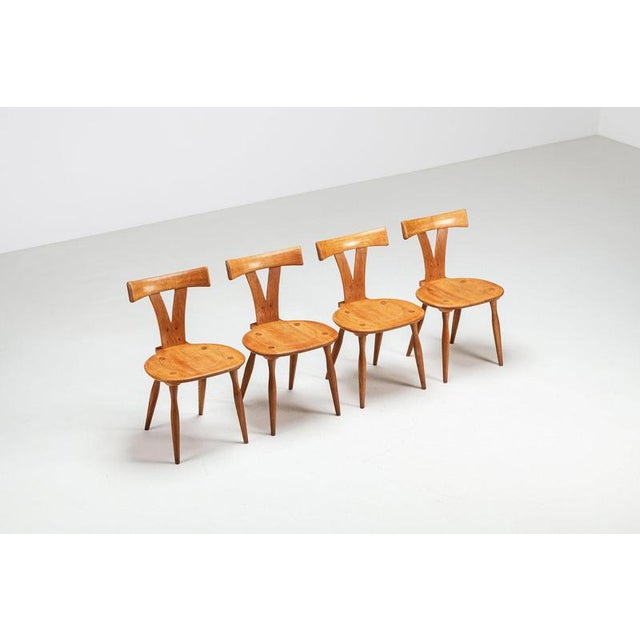 A sculptural set of four Scandinavian dining chairs made in Sweden during the 1960s. Crafted in solid oak, the chairs...